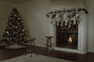Holiday decorations over a fireplace.
